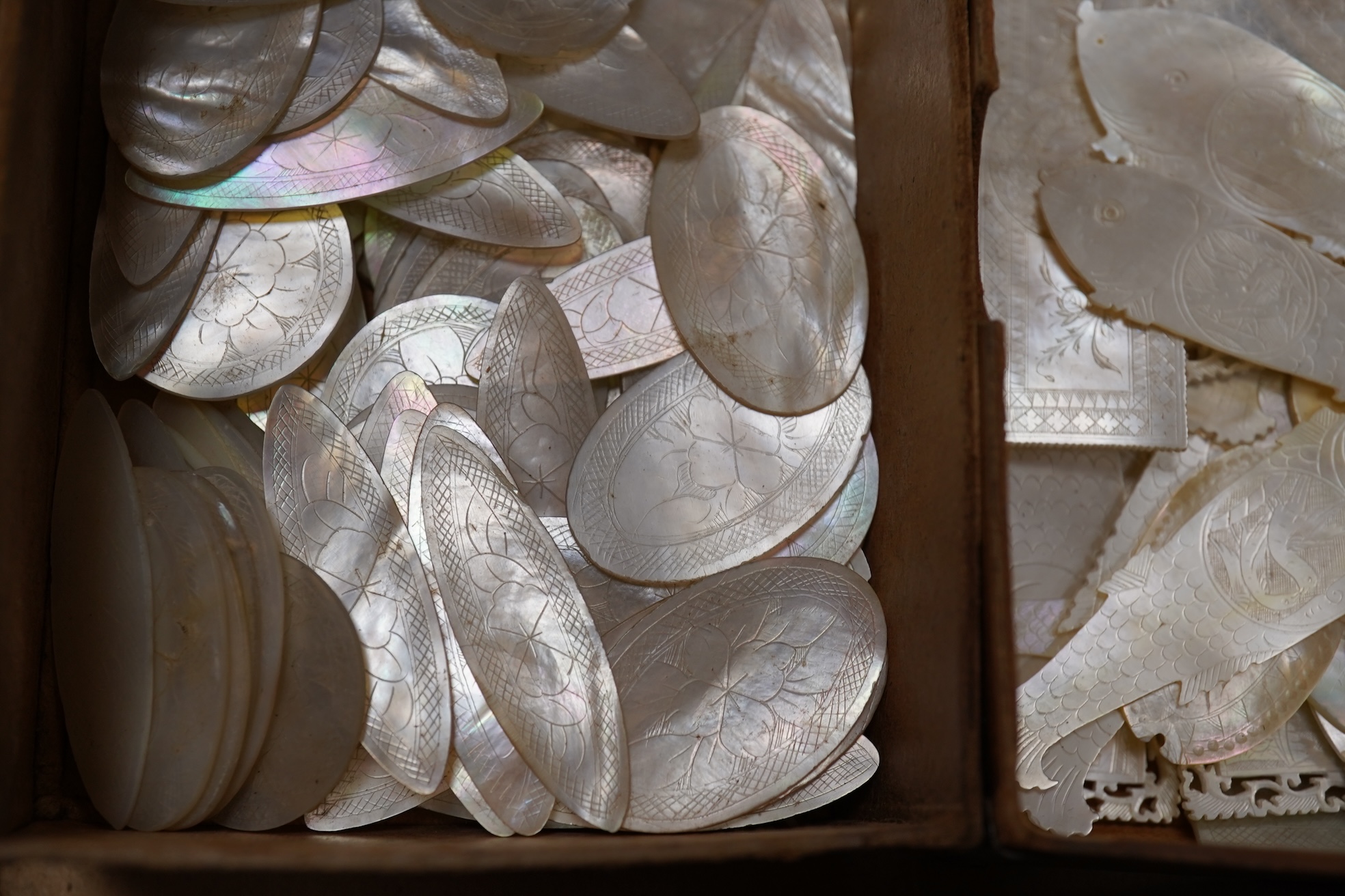 A group of 19th century Chinese mother of pearl gaming counters and accessories, together with a miniature silver cased compass
